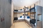 The custom built-in bunk beds provide a fun space for younger guests.